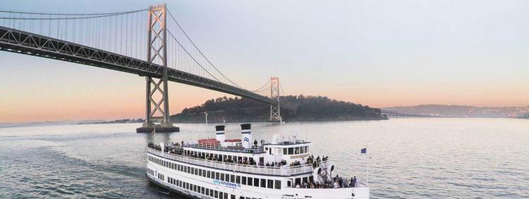 Berkeley City Cruise on the water at sunset by the San Francisco Golden Gate Bridge