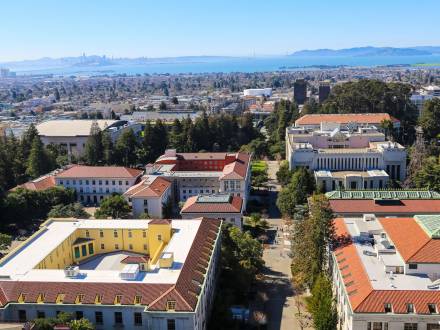 Panoramic view of the UC Berkeley campus buildings and paths from the Campanile observation deck.