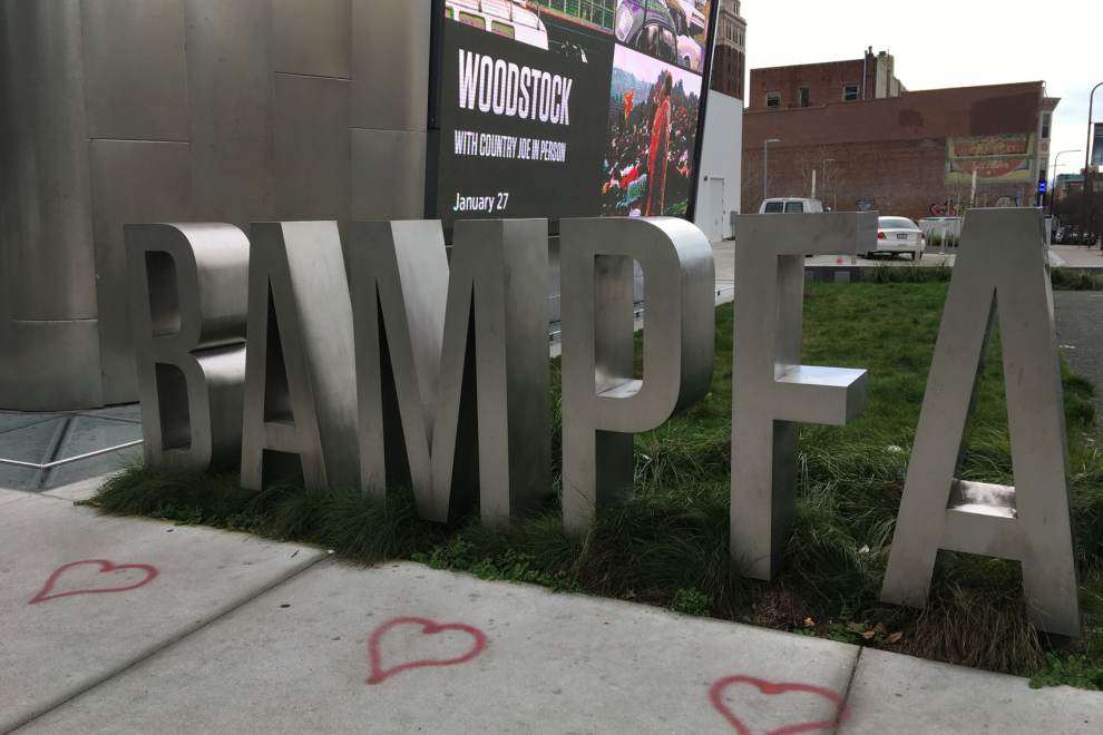 red hearts drawn on the ground in front of the BAMPFA sculpture