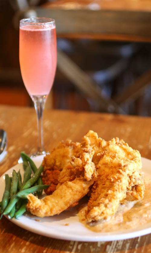 Dish of food from Angeline and drink on a dinner table in downtown Berkeley, California