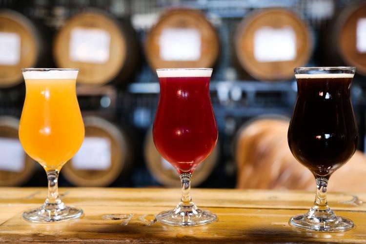 three craft beers on a bar at The Rare Barrel brewery in Berkeley