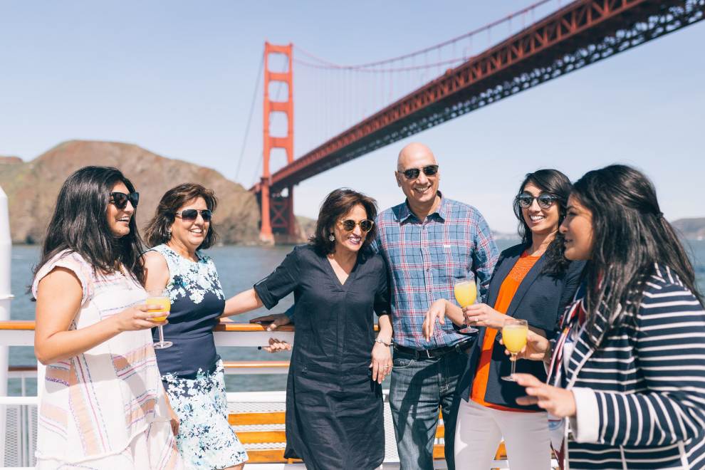 A family has fun in front of the Golden Gate Bridge