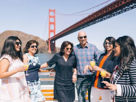 A family has fun in front of the Golden Gate Bridge