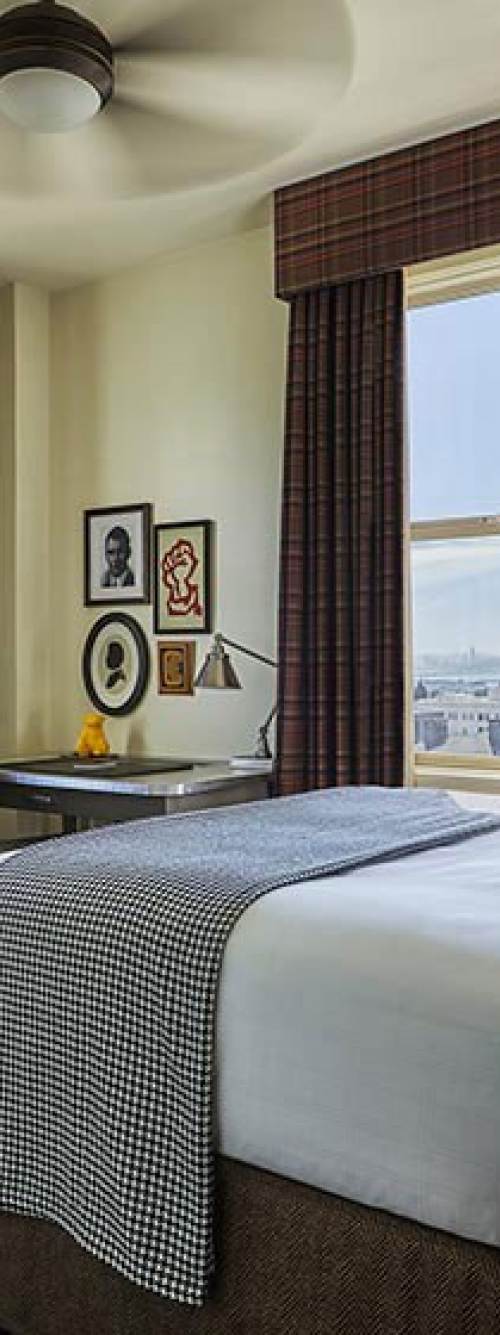 Close-up of the bed in a Graduate Berkeley hotel room