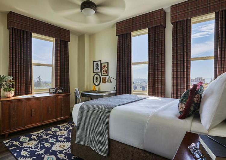 Close-up of the bed in a Graduate Berkeley hotel room
