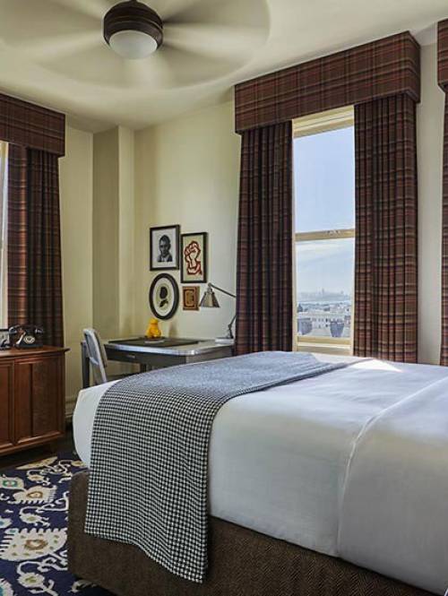 Close-up of the bed in a Graduate Berkeley hotel room