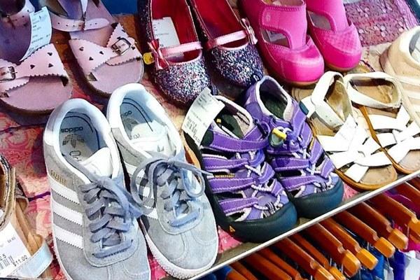 close-up of a variety of children's shoes available at Grove Street Kids thrift store in Berkeley CA