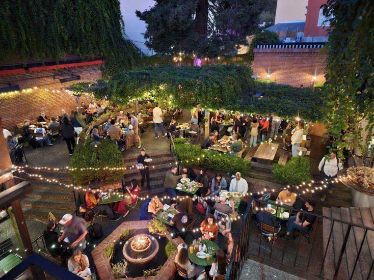 Diners enjoying the outdoor seating area at Jupiter in Berkeley, CA
