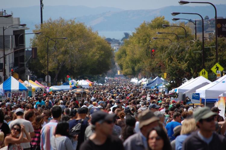crowds of visitors enjoy vendor booths at the Solano Avenue Stroll Credit: Jennifer Hansen Romero
