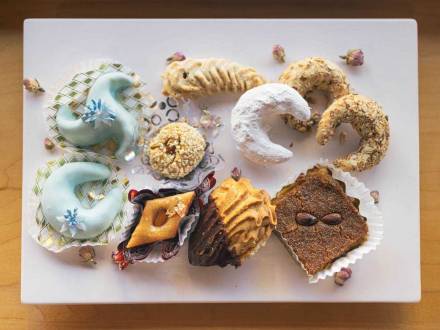 A variety of unique pastries from Belmo Bakery sitting on a white platter