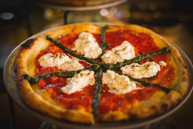 A large three.one four pizzeria pie with tomato sauce and mozerella 